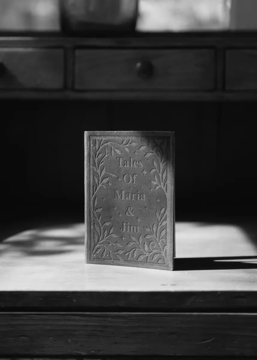 Close detail of engraved book invitation